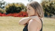 To perform this stretch, sit or stand up straight, then slowly roll your shoulders forward, upward, and backward. (Photo by kindel media/pexels)